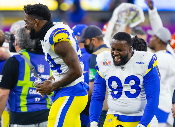Feb 13, 2022; Inglewood, CA, USA; Los Angeles Rams defensive tackle Marquise Copeland (93) and linebacker Leonard Floyd (54) celebrate after defeating the Cincinnati Bengals during Super Bowl LVI at SoFi Stadium. Mandatory Credit: Mark J. Rebilas-USA TODAY Sports